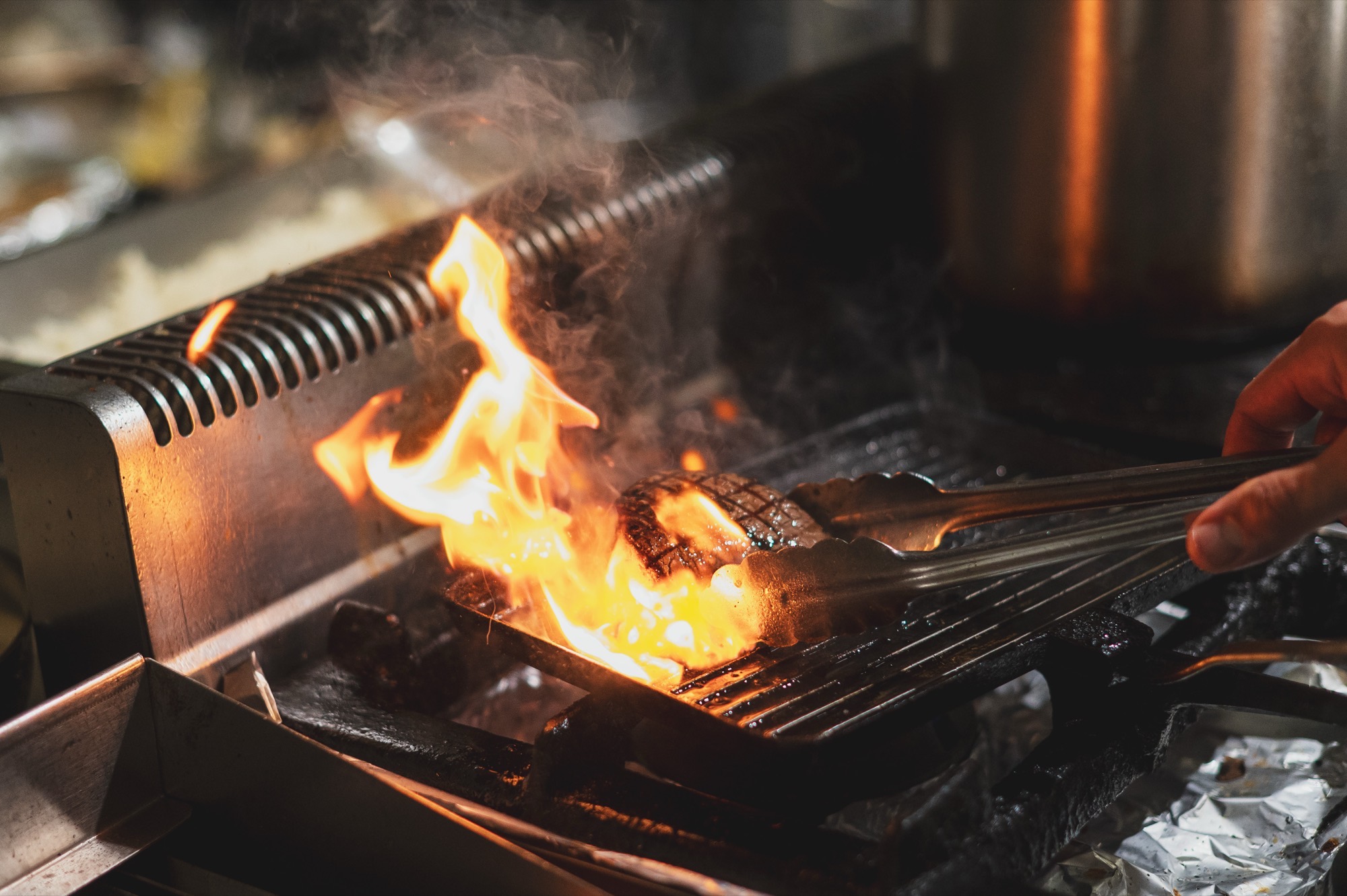Flames over the grill in the kitchen